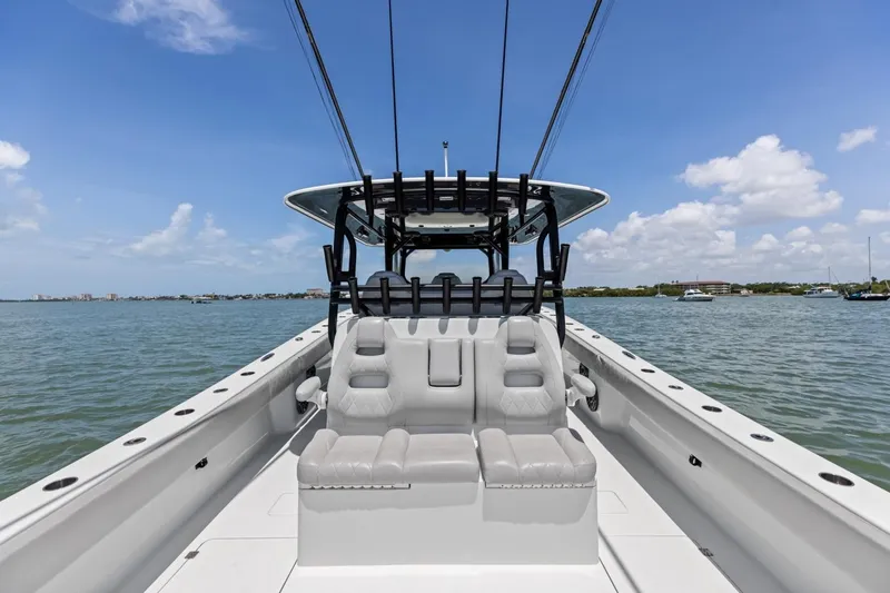 Slide: The Image of 2020 Freeman 42LR boat on water, featuring sleek seating and clear blue skies. - 50
