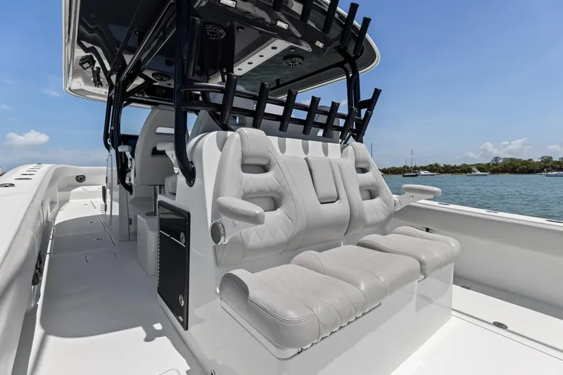 Slide: The Image of Luxury seating on a 2020 Freeman 42LR boat, featuring sleek design and ocean backdrop. - 51