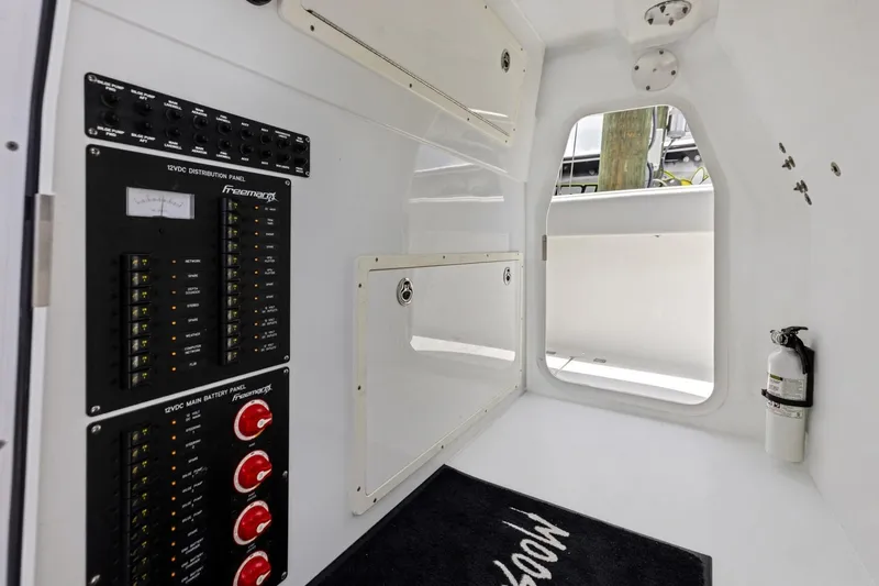 Slide: The Image of Interior of a 2020 Freeman 42LR boat showing control panels and safety equipment. - 56