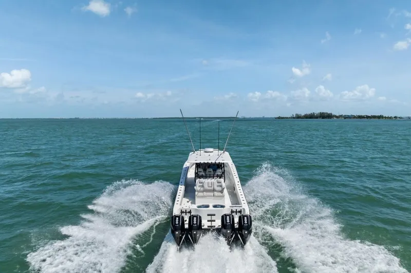 Slide: The Image of Freeman 42LR boat cruising on open water, 2020 model, rear view. - 6