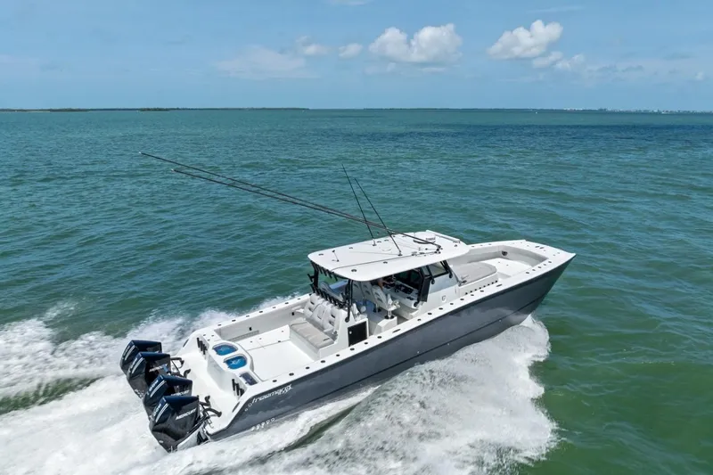Slide: The Image of 2020 Freeman 42LR boat cruising on open water under a clear blue sky. - 7