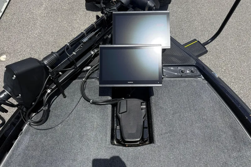 Slide: The Image of Dual Garmin screens on a 2026 Phoenix 921 Elite X II boat dashboard. - 10