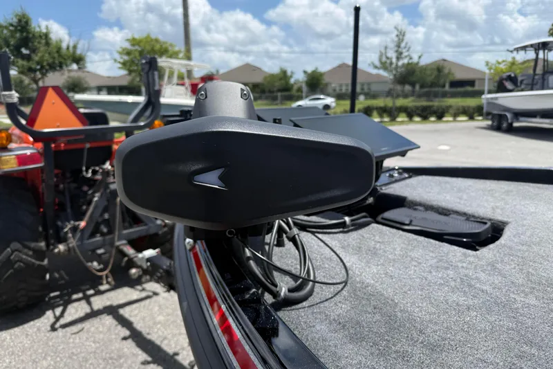 Slide: The Image of 2026 Phoenix 921 Elite X II boat detail with advanced equipment, parked outdoors. - 13