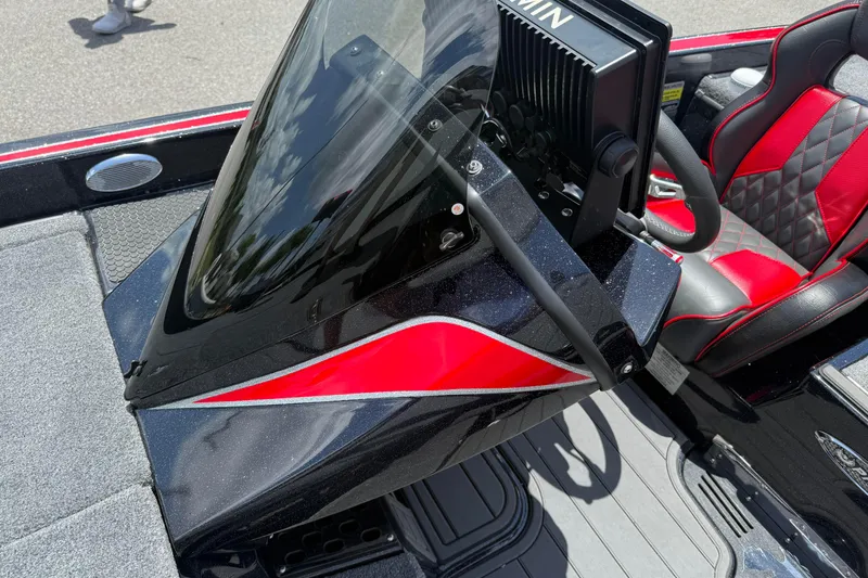 Slide: The Image of 2026 Phoenix 921 Elite X II boat cockpit with red and black seating and Garmin display. - 17