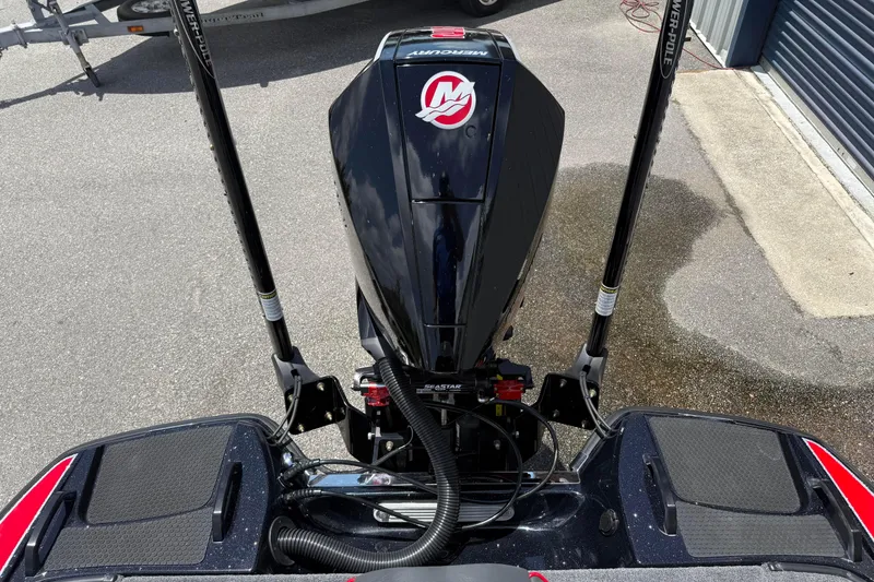 Slide: The Image of 2026 Phoenix 921 Elite X II boat engine with dual Power-Pole anchors on pavement. - 7