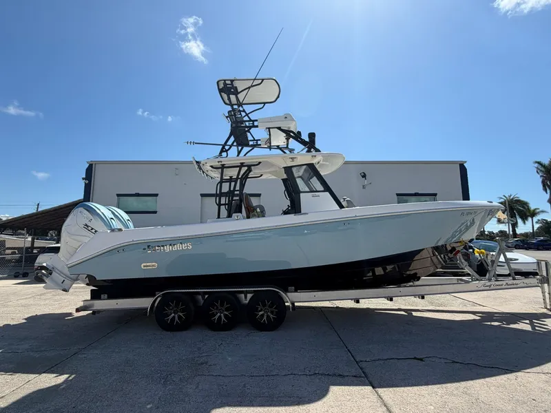 The Image of 2024 Everglades 335 Center Console boat on trailer outdoors. - 1