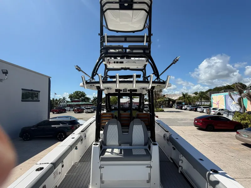 Slide: The Image of 2024 Everglades 335 Center Console boat in parking lot. - 14