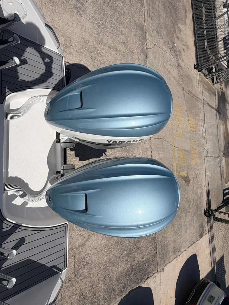 Slide: The Image of 2024 Everglades 335 Center Console with twin Yamaha engines. - 16