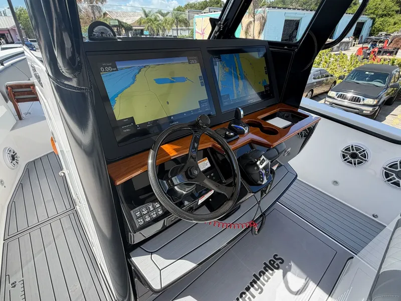Slide: The Image of 2024 Everglades 335 Center Console helm with navigation system. - 26