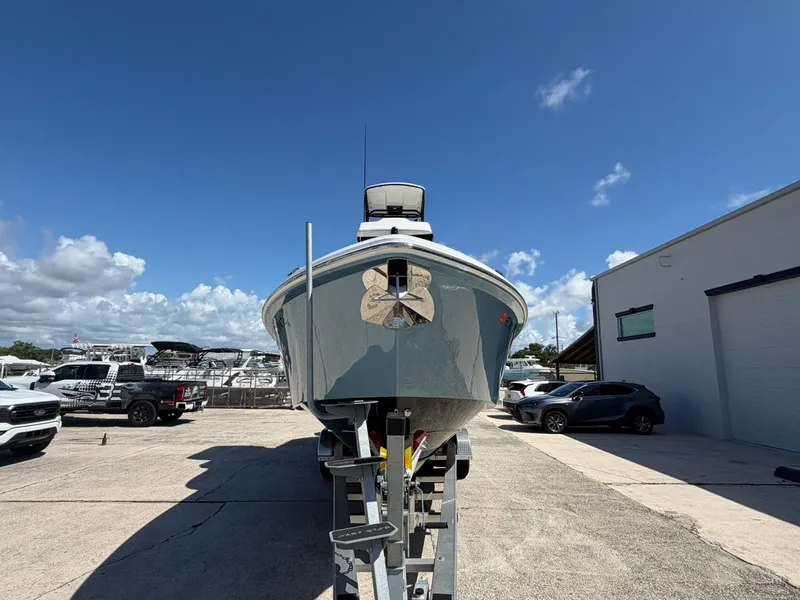 Slide: The Image of 2024 Everglades 335 Center Console boat on trailer outdoors. - 3