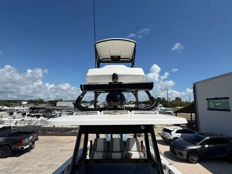 Slide: The Image of Everglades 335 Center Console 2024 on a lot under sunny skies. - 31