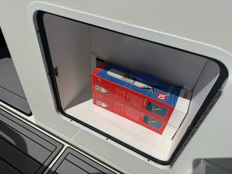 Slide: The Image of Storage compartment in Everglades 335 Center Console boat, 2024 model. - 47