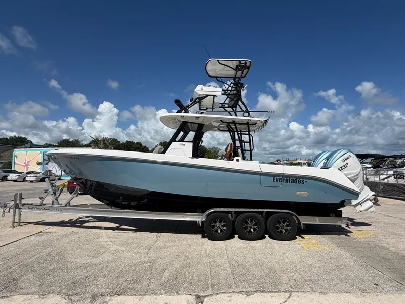 Slide: The Image of 2024 Everglades 335 Center Console boat on trailer. - 5
