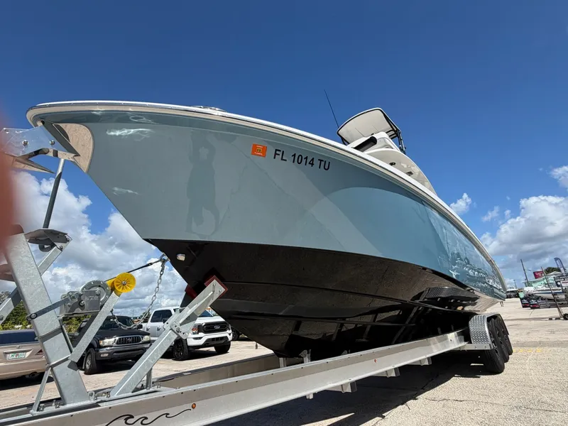 Slide: The Image of 2024 Everglades 335 Center Console on trailer, blue sky. - 6