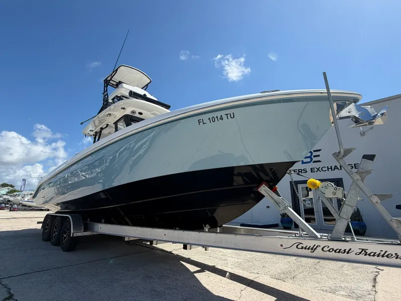 Slide: The Image of 2024 Everglades 335 Center Console on trailer, blue sky. - 7