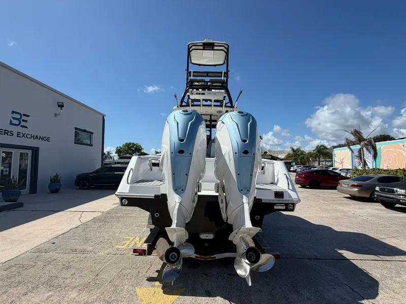 Slide: The Image of 2024 Everglades 335 Center Console with twin outboard engines. - 9