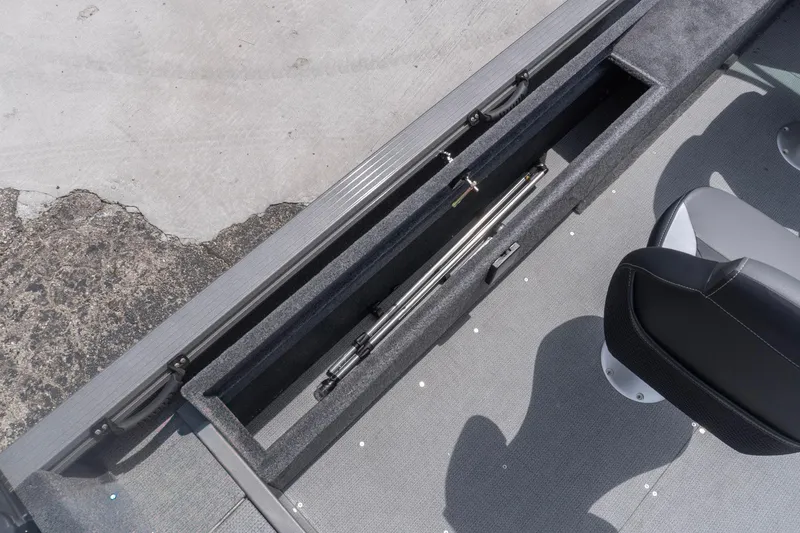 Slide: The Image of 2026 G3 Angler V21 F boat interior with rod storage compartment and seating. - 22