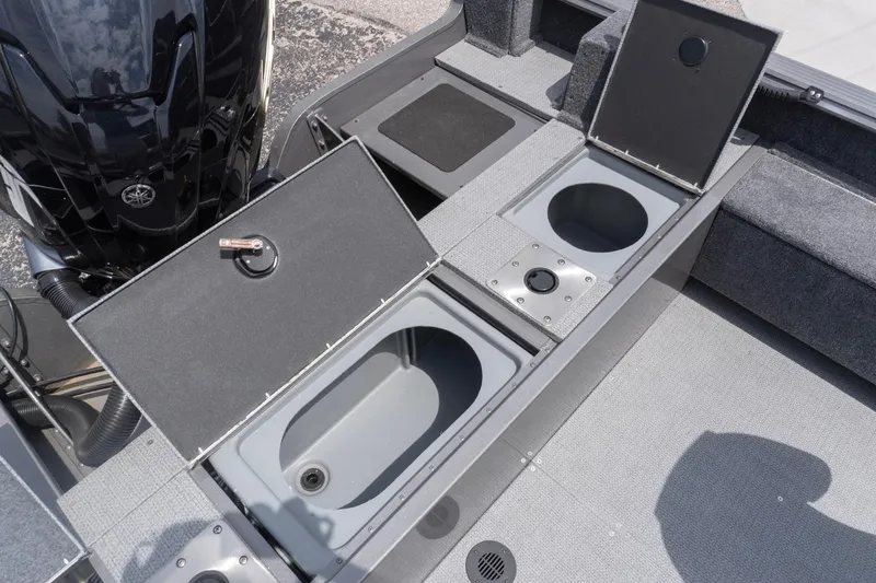 Slide: The Image of 2026 G3 Angler V21 F boat with storage compartments and motor. - 25