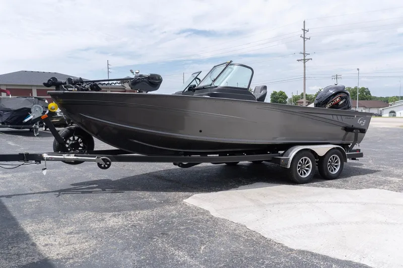 Slide: The Image of 2026 G3 Angler V21 F fishing boat on trailer in parking lot. - 3