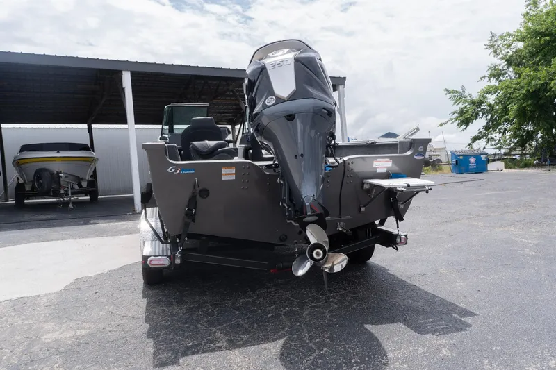 Slide: The Image of 2026 G3 Angler V21 F boat with outboard motor in parking lot. - 4