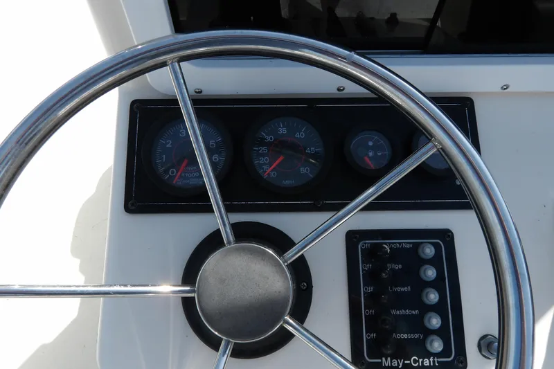 Slide: The Image of Steering wheel and dashboard of 2005 May-Craft 1800 Skiff boat. - 12