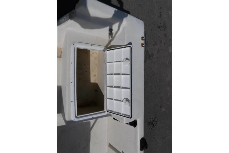 Slide: The Image of Open storage compartment on a 2005 May-Craft 1800 Skiff boat. - 15