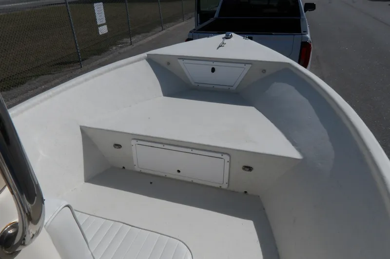 Slide: The Image of 2005 May-Craft 1800 Skiff boat with storage and seating area. - 18