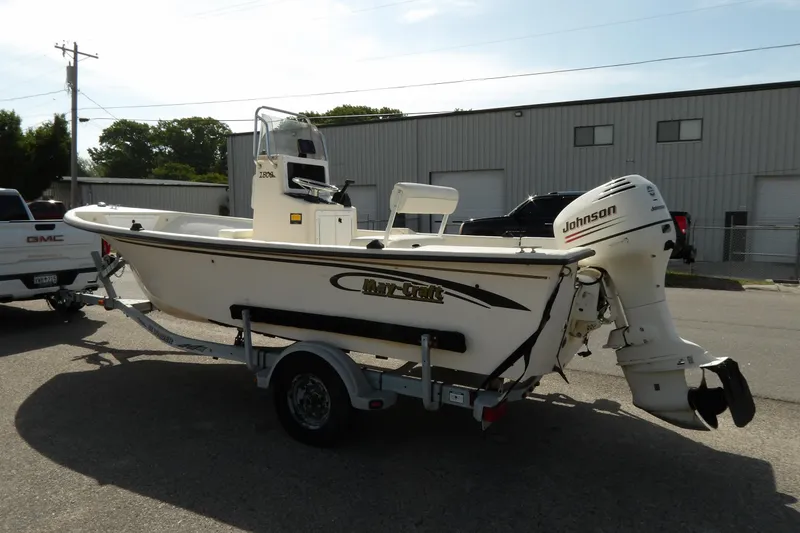 Slide: The Image of 2005 May-Craft 1800 Skiff boat on trailer with Johnson outboard motor. - 4