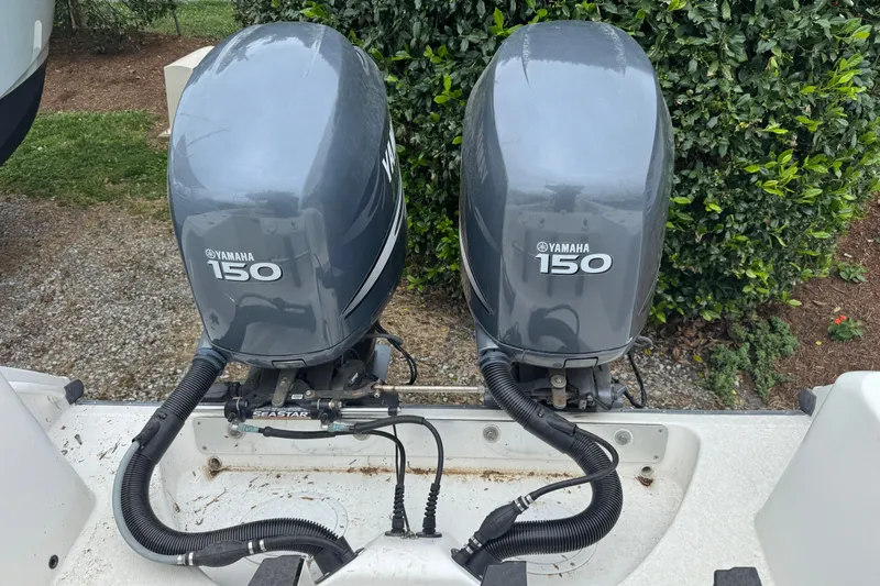 Slide: The Image of Twin Yamaha 150 outboard engines on a 2007 Edgewater 245CC boat. - 10
