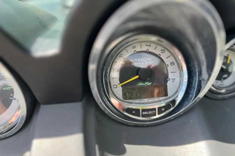 Slide: The Image of Close-up of 2011 Sea Ray 260 Sundeck tachometer displaying RPM and voltage. - 19