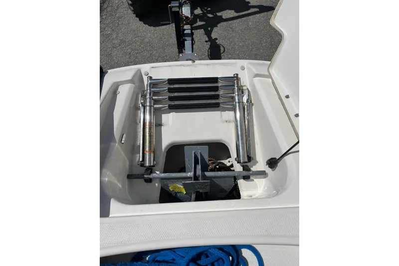 Slide: The Image of 2011 Sea Ray 260 Sundeck anchor storage compartment with ladder and accessories. - 24