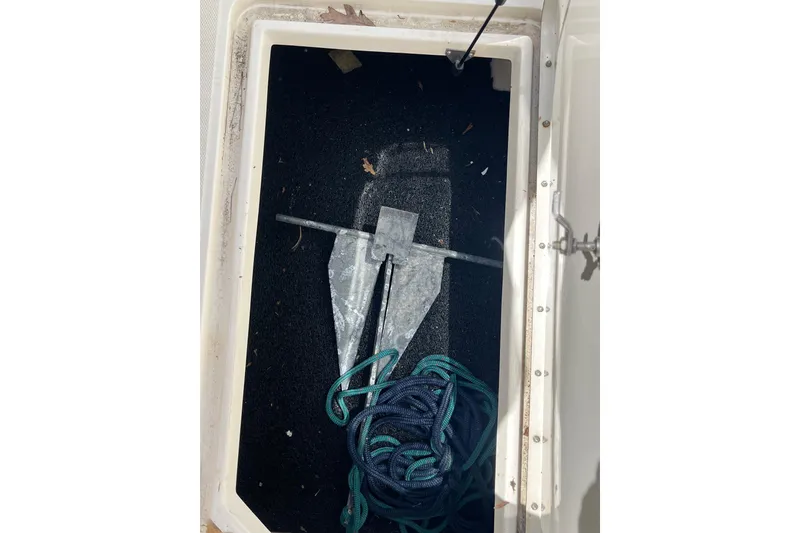 Slide: The Image of Anchor and rope storage in 2011 Sea Ray 260 Sundeck compartment. - 31