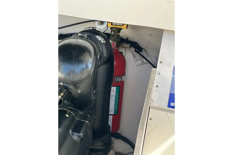 Slide: The Image of Engine compartment of a 2011 Sea Ray 260 Sundeck with a fire extinguisher. - 33