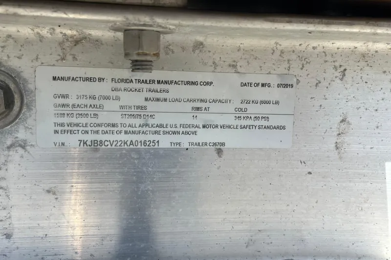 Slide: The Image of Label on Florida Trailer Manufacturing Corp trailer, showing specifications and VIN. - 38