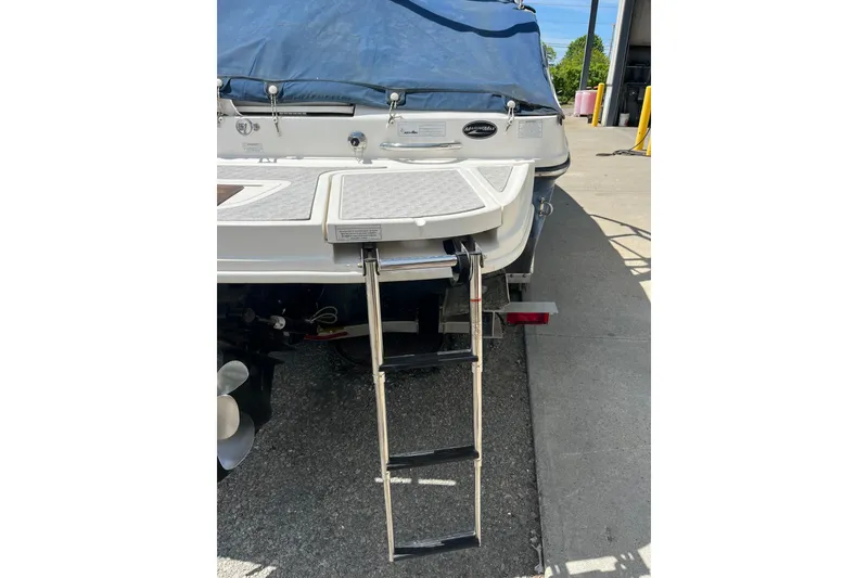 Slide: The Image of 2011 Sea Ray 260 Sundeck boat with extended swim platform and ladder. - 6
