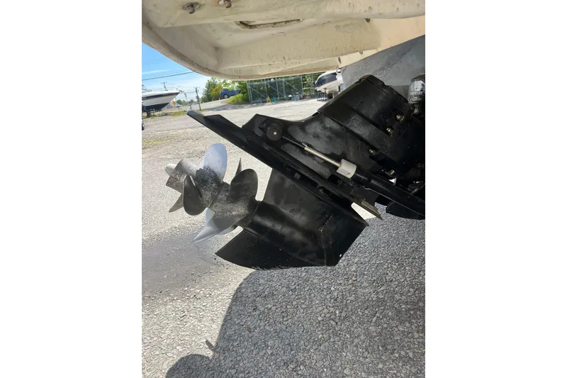 Slide: The Image of Close-up of a 2011 Sea Ray 260 Sundeck boat propeller on a gravel surface. - 7