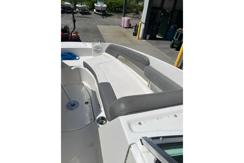 Slide: The Image of 2011 Sea Ray 260 Sundeck boat interior with gray seating and open deck area. - 9