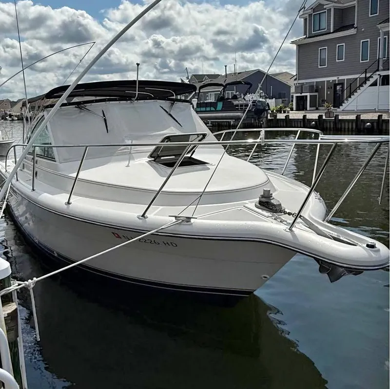 The Image of 1999 Tiara Yachts 2900 Coronet docked, cloudy sky. - 0