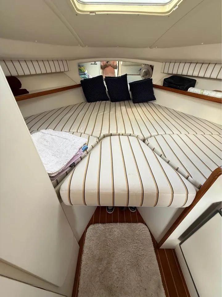Slide: The Image of Interior of a 1999 Tiara Yachts 2900 Coronet with cushioned sleeping area. - 3