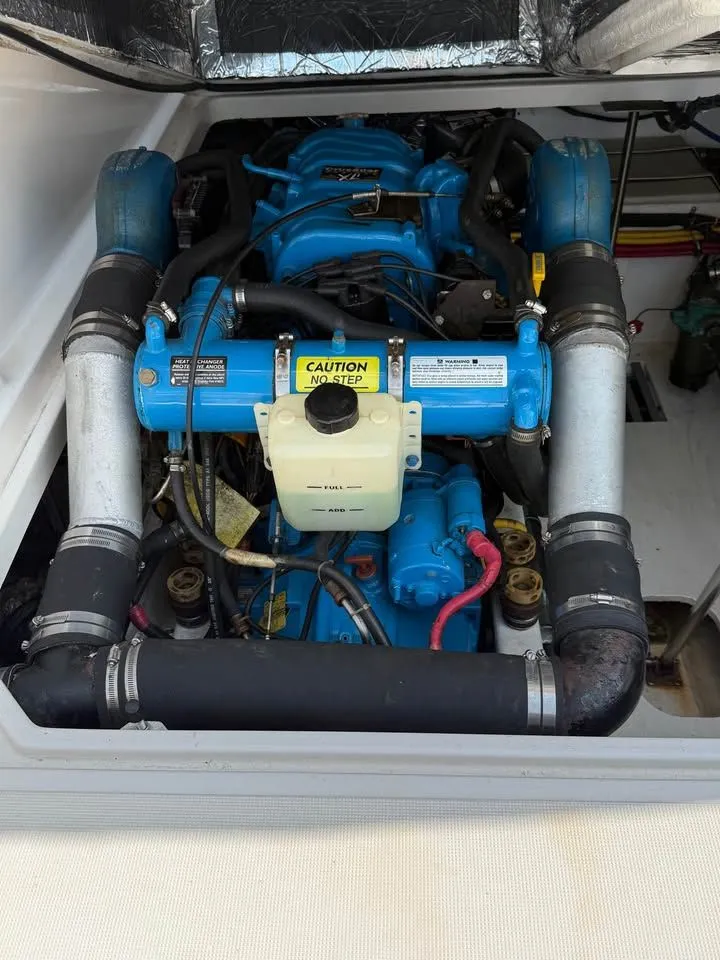 Slide: The Image of Engine compartment of a 1999 Tiara Yachts 2900 Coronet with blue engine cover. - 5
