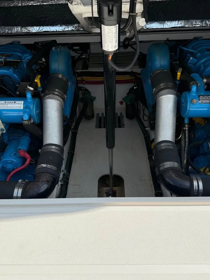 Slide: The Image of Engine compartment of a 1999 Tiara Yachts 2900 Coronet with blue engines. - 7