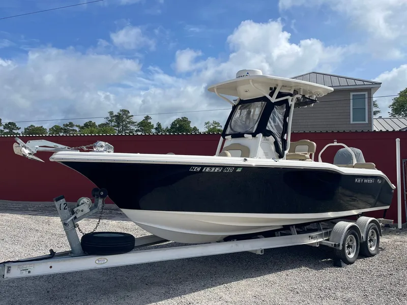 The Image of 2017 Key West 239 FS boat on trailer, blue sky. - 0