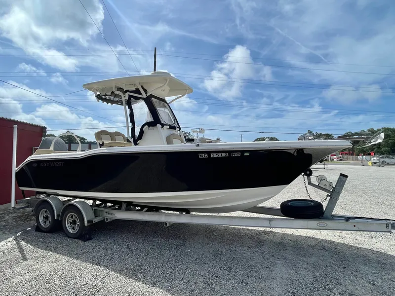 Slide: The Image of 2017 Key West 239 FS boat on trailer, blue sky. - 10