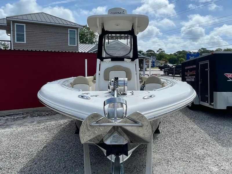 Slide: The Image of 2017 Key West 239 FS boat, front view on gravel lot. - 12