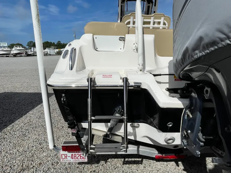 Slide: The Image of Rear view of a 2017 Key West 239 FS boat with ladder. - 13