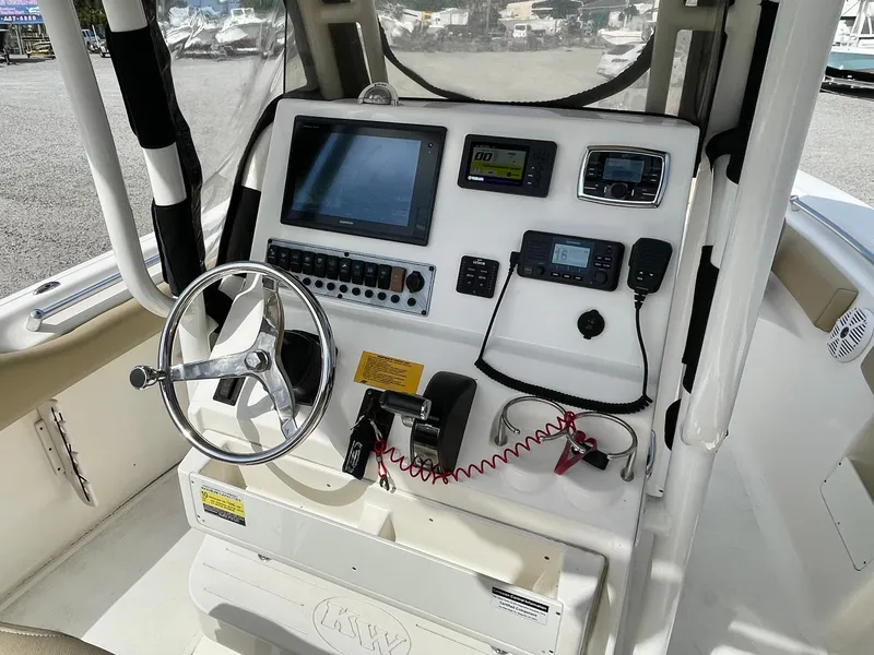 Slide: The Image of 2017 Key West 239 FS boat dashboard with steering wheel. - 15
