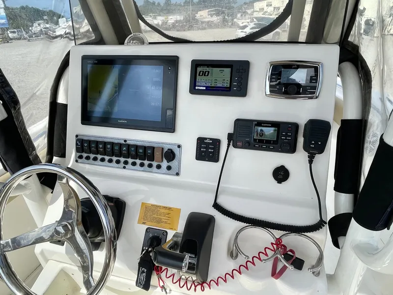 Slide: The Image of 2017 Key West 239 FS helm with electronics and controls. - 18