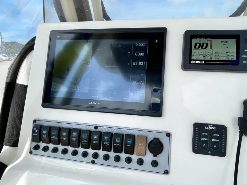 Slide: The Image of 2017 Key West 239 FS boat dashboard with Garmin and Yamaha displays. - 19