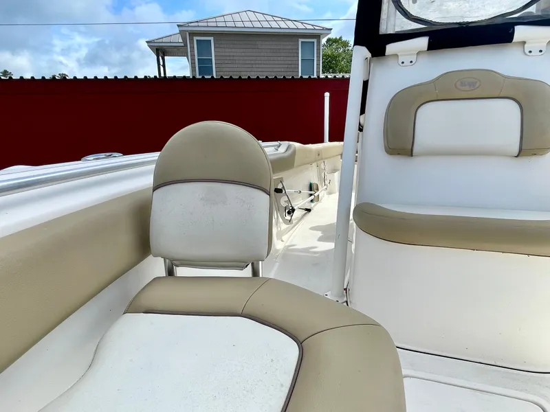 Slide: The Image of Interior of a 2017 Key West 239 FS boat with beige seating. - 37