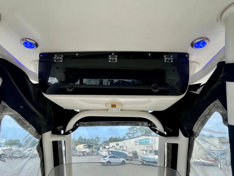 Slide: The Image of Interior view of a 2017 Key West 239 FS boat with blue lighting. - 43